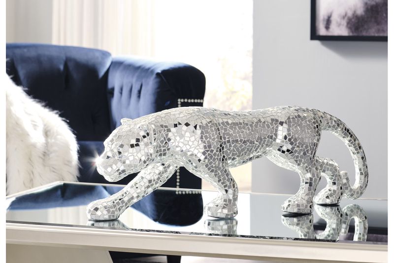 Drice sculpture that looks like a panther made of shiny material